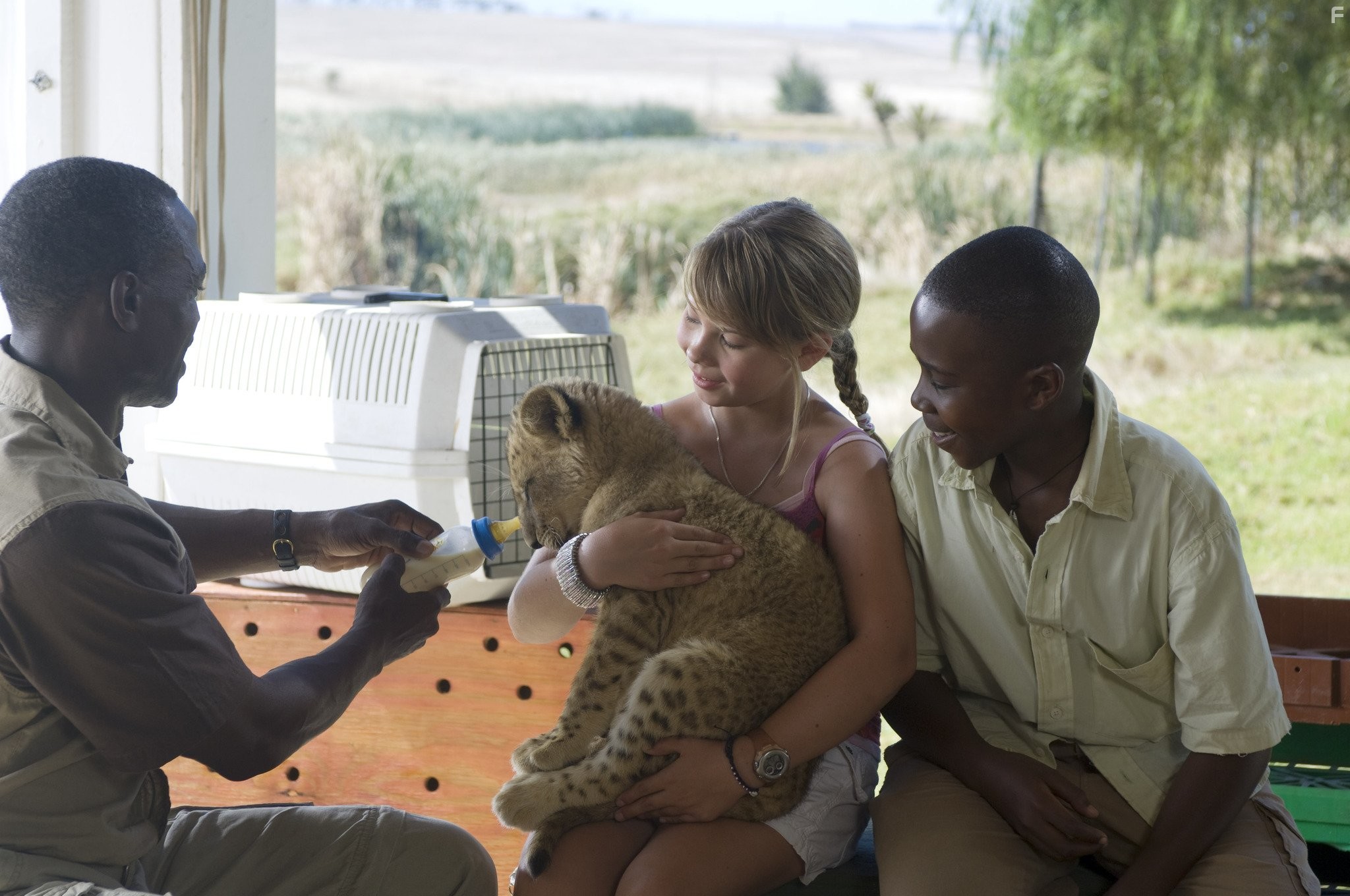 Uncle Rudy, Bindi Irwin, Getmore Sithole, and Siyabulela Ramba in Free Willy: Escape from Pirate's Cove (2010)