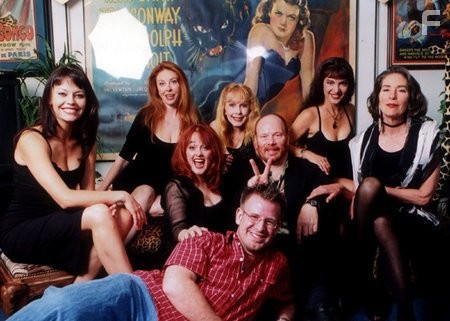 Jason Paul Collum (center) with (l-r) Musetta Vander, Cassandra Peterson, Julie Brown (I), Stella Stevens, Sam Irvin, Brinke Stevens, Mary Woronov for Femme Fatales photo story on career of director Sam Irvin. Collum interviewed director Irvin & his common actors/friends from Irvin's films ACTING ON IMPULSE (1993), OBLIVION (1994), OUT THERE (1995), and ELVIRA'S HAUNTED HILLS (2001).