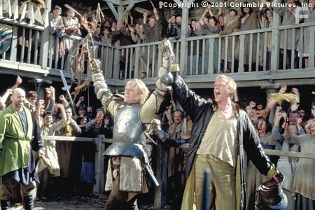 (From left to right) William (Heath Ledger) and Chaucer (Paul Bettany) celebrate one of the young knight's many victories on the tournament field