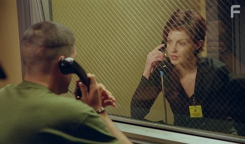 Claire (ASHLEY JUDD) has an emotional conversation with her newly imprisoned husband Tom (JAMES CAVIEZEL).