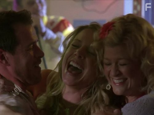 Dana Wheeler-Nicholson and Derek Phillips in Огни ночной пятницы (2006)