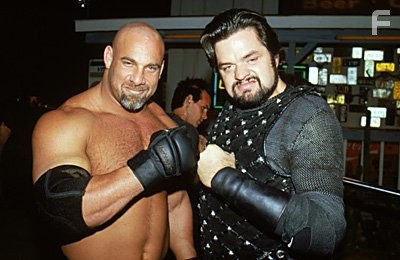 Bill Goldberg (appearing as himself) poses with Oliver Platt (appearing as Jimmy King)