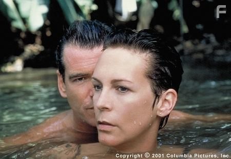 Louisa Pendel (Jamie Lee Curtis) harbors suspicions about smooth British spy Andrew Osnard (Pierce Brosnan)