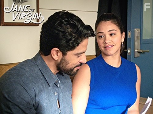 Adam Rodriguez and Gina Rodriguez in Девственница Джейн (2014)