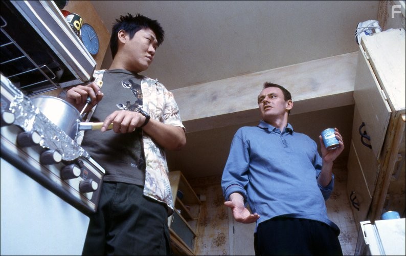 Sean Lock and Benedict Wong in 15 Storeys High (2002)