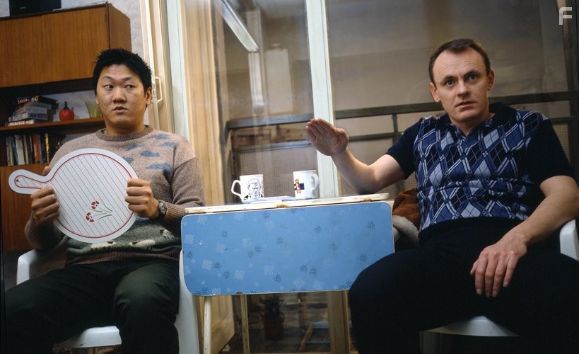 Sean Lock and Benedict Wong in 15 Storeys High (2002)