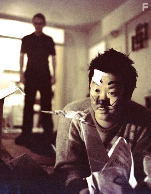 Sean Lock and Benedict Wong in 15 Storeys High (2002)