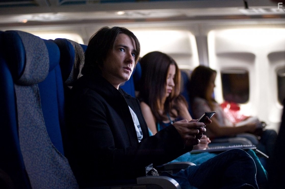 Alex Frost and Christian Serratos in 7500 (2014)