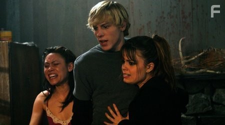 Stars Trevor Duke as Derek Cowley and Kimberly J. Brown as Sam (center and right) and Jennifer Roa as Breanna react to a friend meeting a grisly demise at the claws of the Beast.